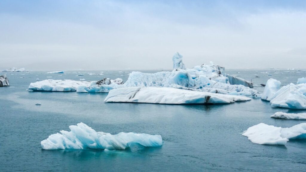 Serene view of icebergs floating in the calm waters of Jokulsarlon Lagoon, Iceland.