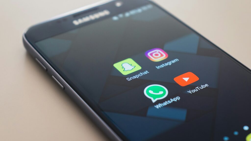 Close up of a smartphone screen displaying different social media platforms.